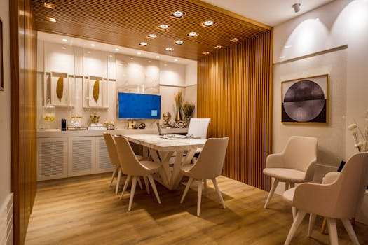 Stylish modern dining room showcasing luxurious interior design with warm wooden accents.